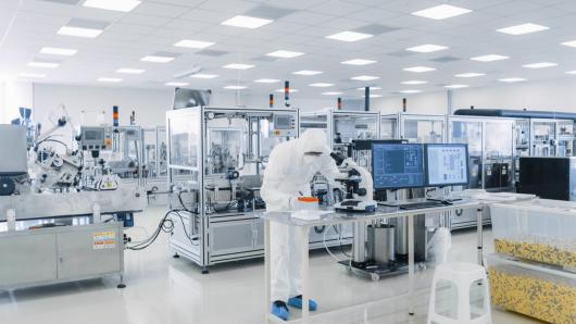 harvard university strategic plan 2020 Lab worker in PPE working with laboratory equipment