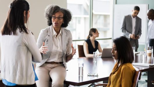 harvard university strategic plan 2020 Executives in a board room casually talking