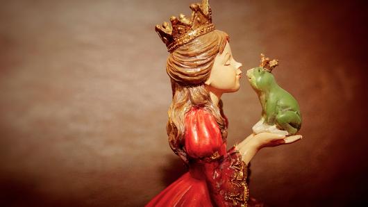 statue of young princess holding frog