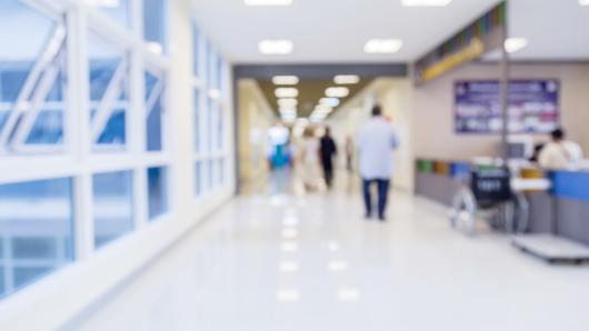 A blurry hospital corridor.